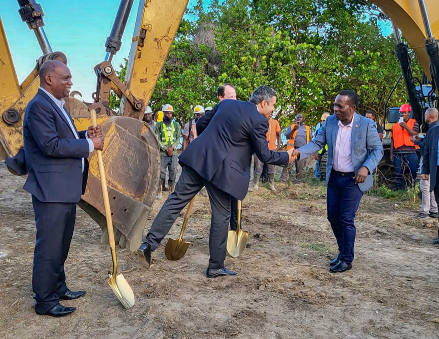Mohammed Asaria of Range Developments shakes the hand of Grenada's Prime Minster, Dr. Keith Mitchell in the presence of the Parliamentary Representative for the parish of St. David, Hon. Oliver Joseph